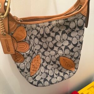 Denim Coach hobo-style bag with beautiful floral embroidery